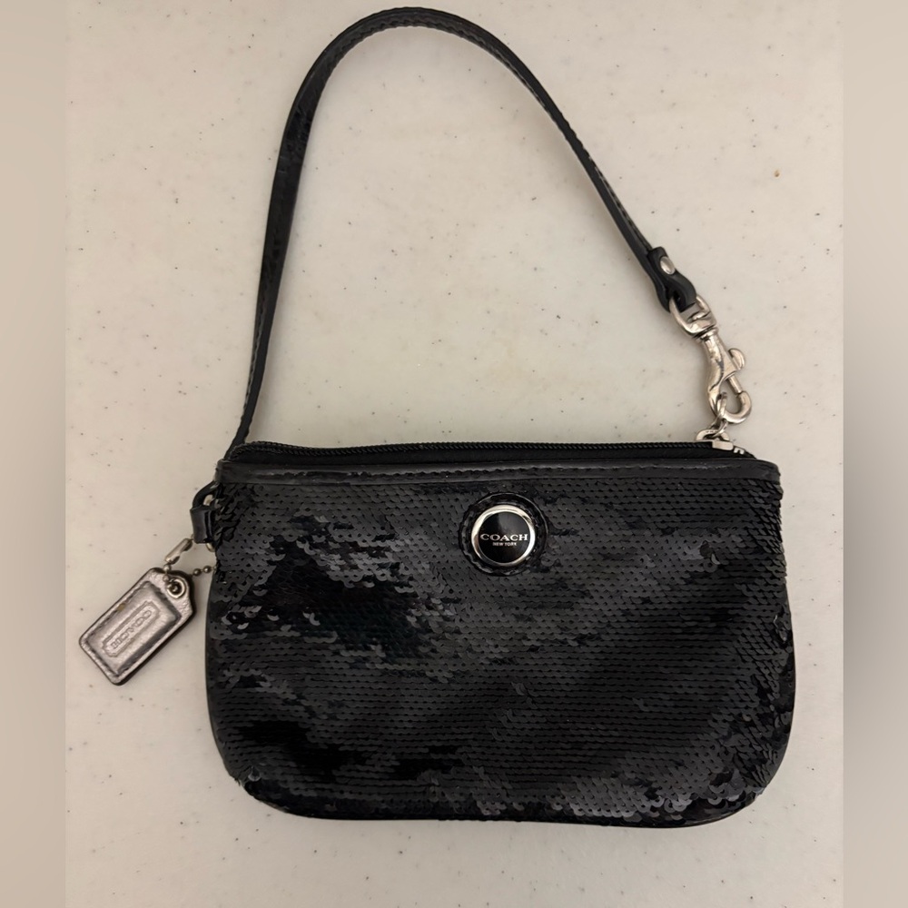 COACH wristlet with sequins black with 2 credit slots inside.